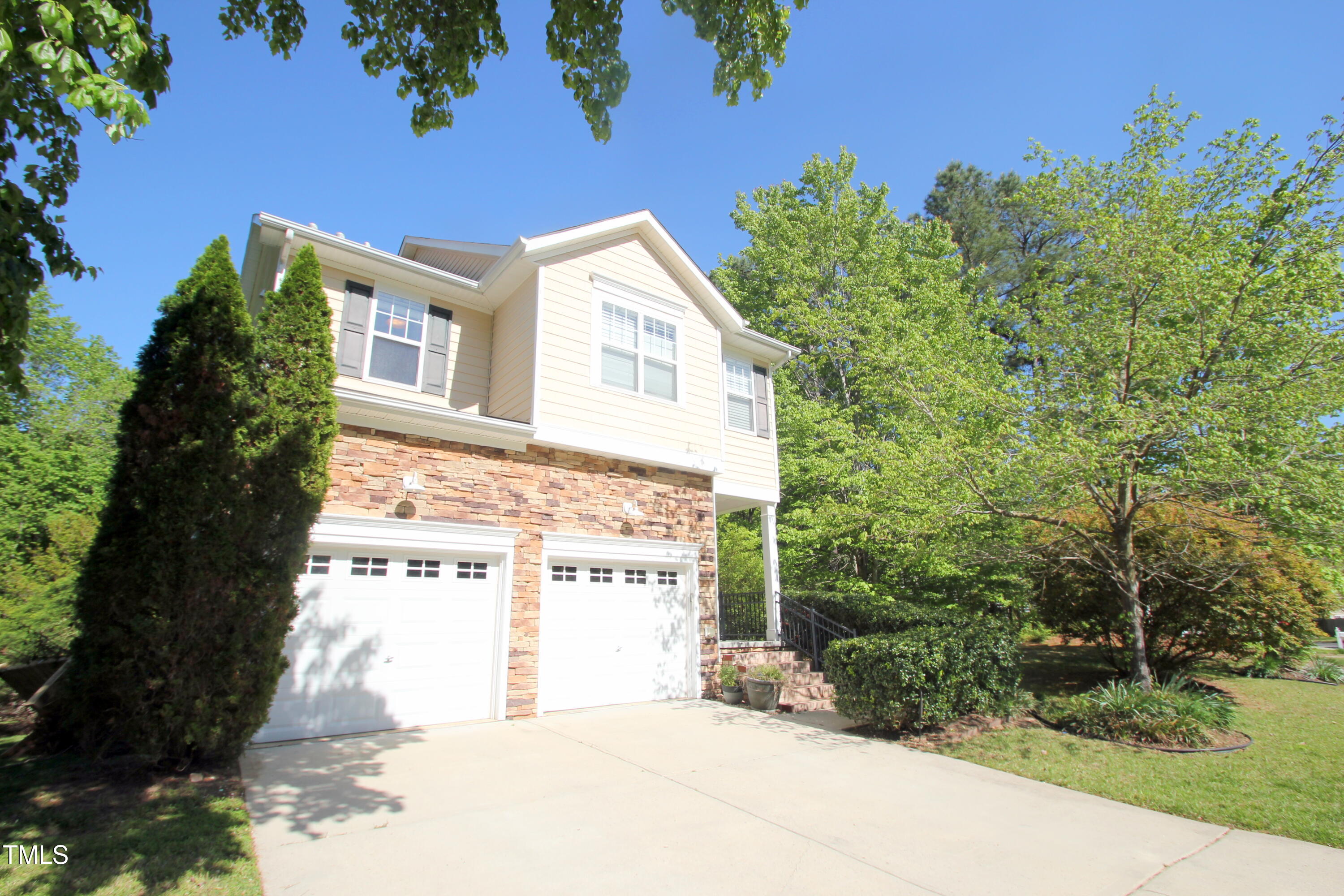 3219 Ranbir Drive Durham, NC 27713 - Photo 2 of 4 a view of a house with a yard