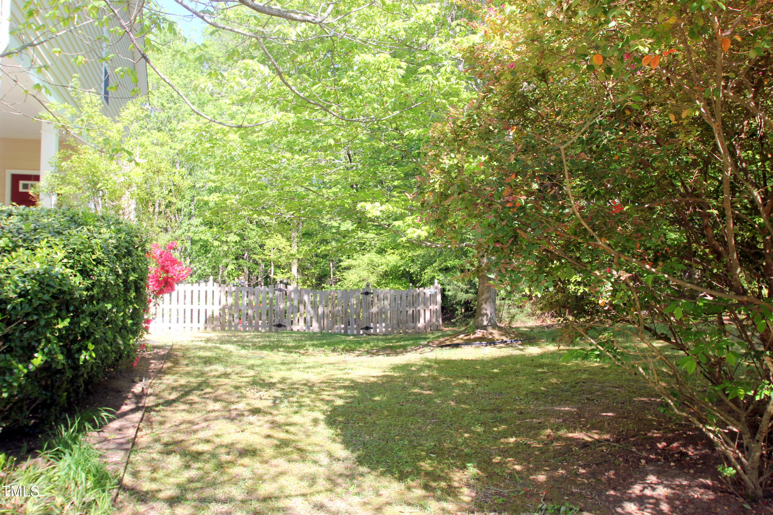 3219 Ranbir Drive Durham, NC 27713 - Photo 4 of 4 a view of a yard with large trees