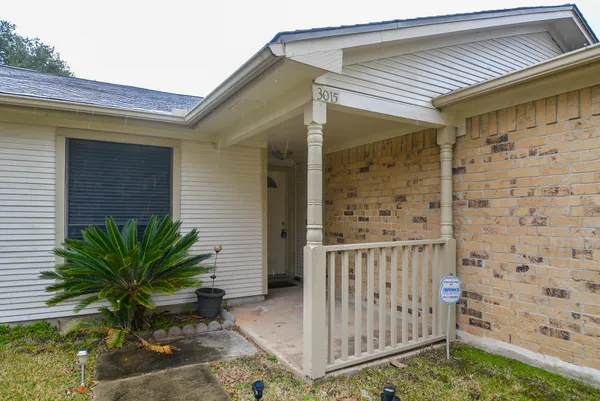 a view of a house with a small yard