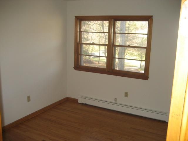 6206 Meacham Road Salem, VA 24153 - Photo 12 of 23 an empty room with wooden floor and windows