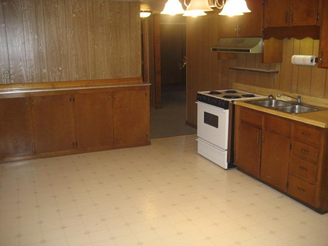 6206 Meacham Road Salem, VA 24153 - Photo 21 of 23 a kitchen with cabinets and white appliances