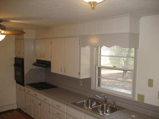 6206 Meacham Road Salem, VA 24153 - Photo 8 of 23 a kitchen with granite countertop a sink and a stove