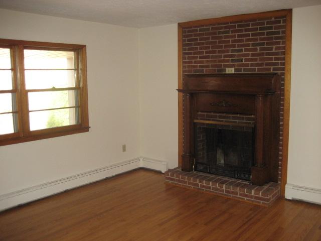 6206 Meacham Road Salem, VA 24153 - Photo 10 of 23 a view of an empty room with wooden floor and a window