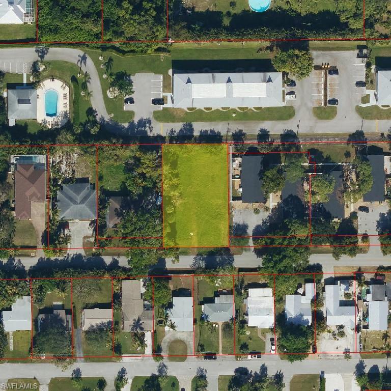 an aerial view of houses with outdoor space