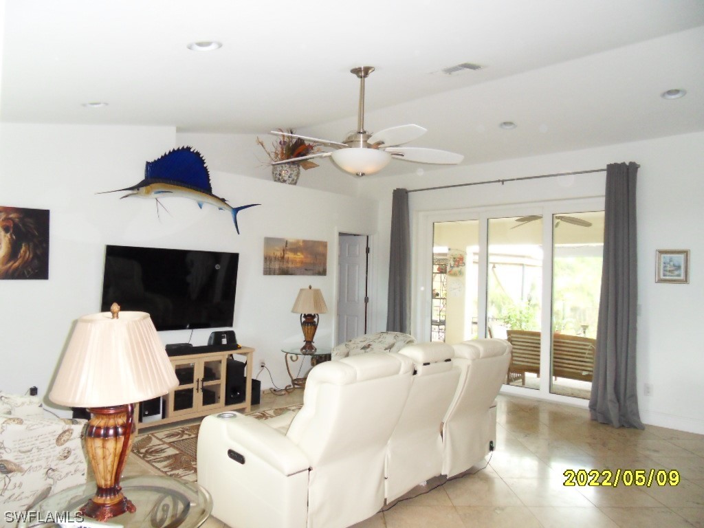 18283 Useppa Road Fort Myers, FL 33967 - Photo 3 of 16 a living room with furniture and a flat screen tv