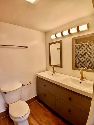 a bathroom with a toilet and a sink