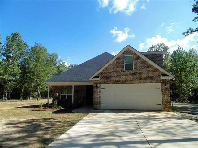 342 Duke Road Perry, GA 31069 - Photo 1 of 34 a front view of a house with a yard and garage