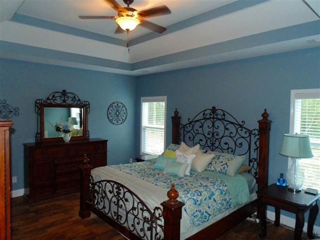 342 Duke Road Perry, GA 31069 - Photo 14 of 34 a bedroom with a bed window and a table