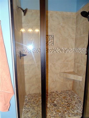 342 Duke Road Perry, GA 31069 - Photo 17 of 34 a bathroom with a shower and a sink