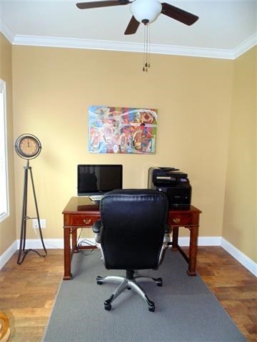 342 Duke Road Perry, GA 31069 - Photo 19 of 34 a view of a workspace with furniture and a wooden floor