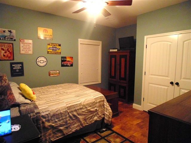 342 Duke Road Perry, GA 31069 - Photo 21 of 34 a bedroom with a bed and a dresser