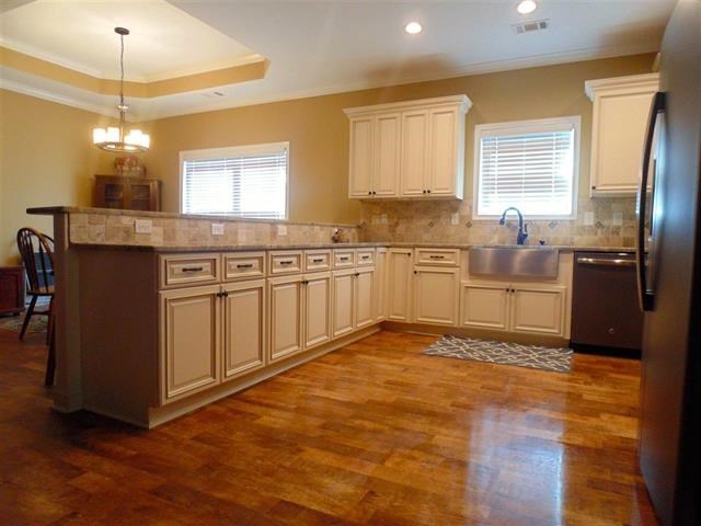 342 Duke Road Perry, GA 31069 - Photo 8 of 34 a kitchen with stainless steel appliances granite countertop a stove sink and cabinets