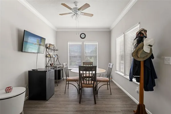 a view of a dining room with furniture window and wooden floor