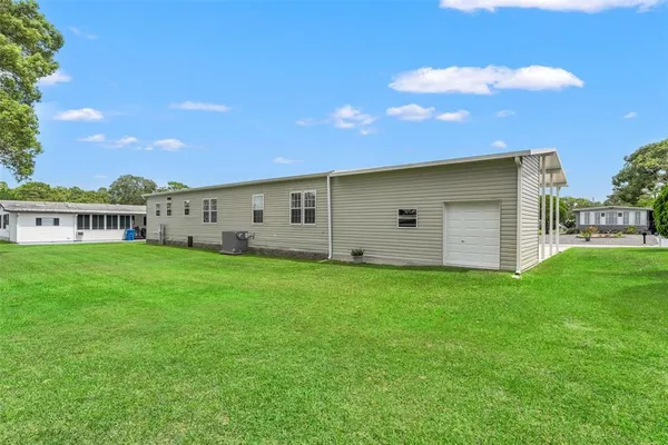 a view of a house with backyard