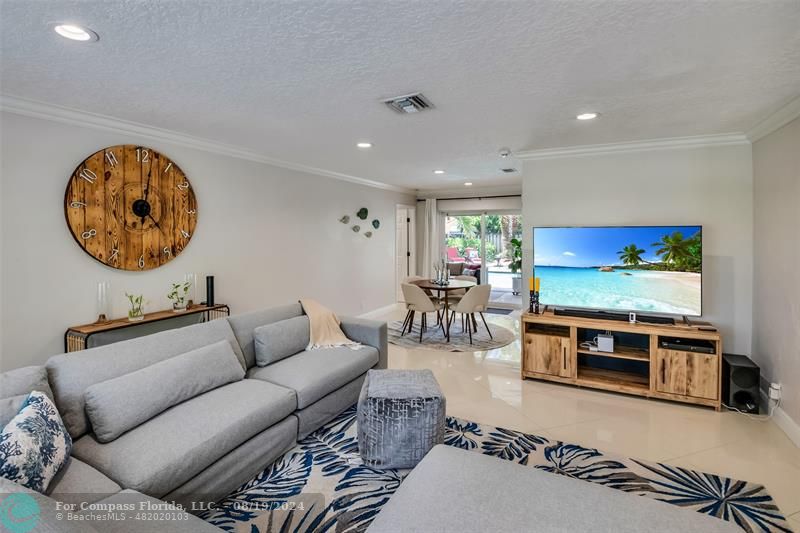 Undisclosed Address Pompano Beach, FL 33062 - Photo 11 of 63 a living room with furniture and a flat screen tv