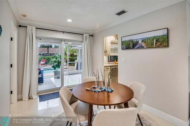 Undisclosed Address Pompano Beach, FL 33062 - Photo 13 of 63 a dining room with furniture and wooden floor
