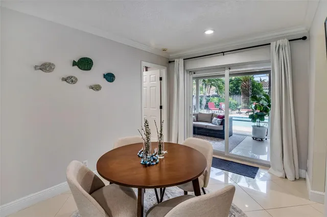 a kitchen with granite countertop a refrigerator and a stove