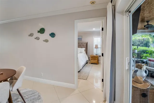 a dining room with furniture and a chandelier