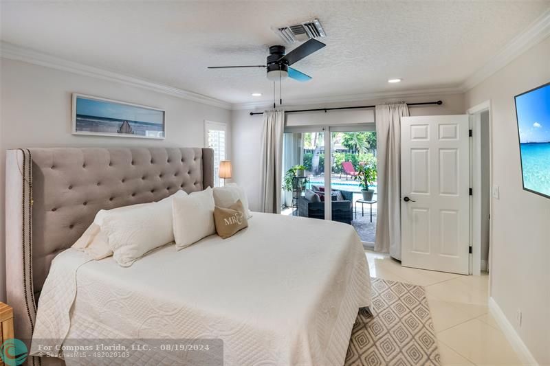 Undisclosed Address Pompano Beach, FL 33062 - Photo 27 of 63 a bedroom with a large bed and a window