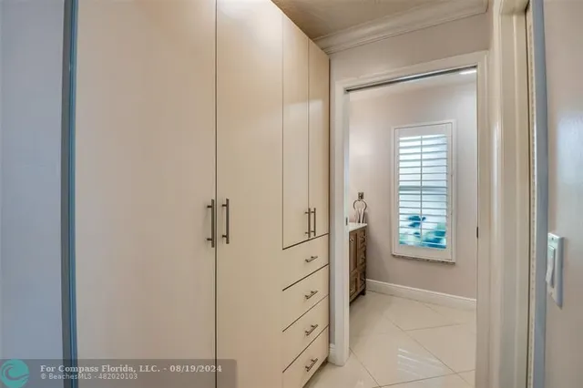 a bedroom with a bed and a chair