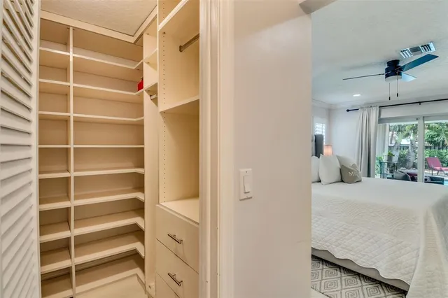 a bedroom with a bed and a chair