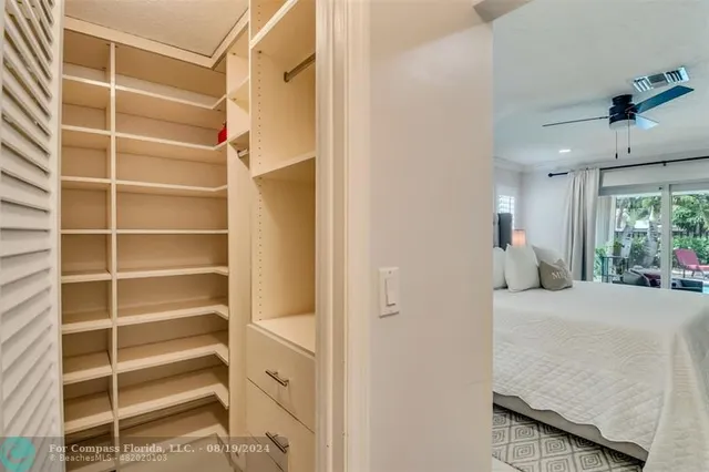 a utility room with refrigerator and washer