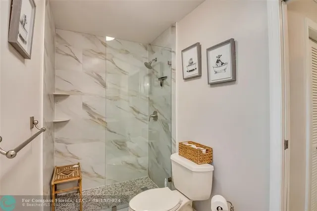 a utility room with cabinets washer and dryer