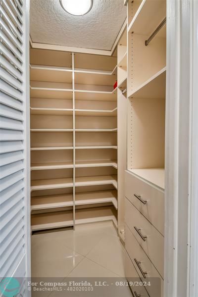 Undisclosed Address Pompano Beach, FL 33062 - Photo 36 of 63 a view of walk in closet with empty racks