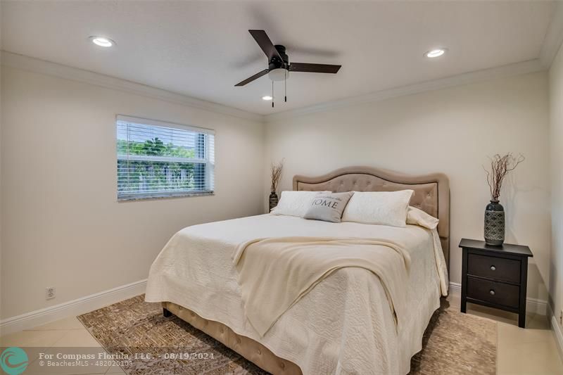 Undisclosed Address Pompano Beach, FL 33062 - Photo 37 of 63 a bedroom with a bed and a window