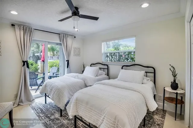 a dining room with furniture a rug and a large window