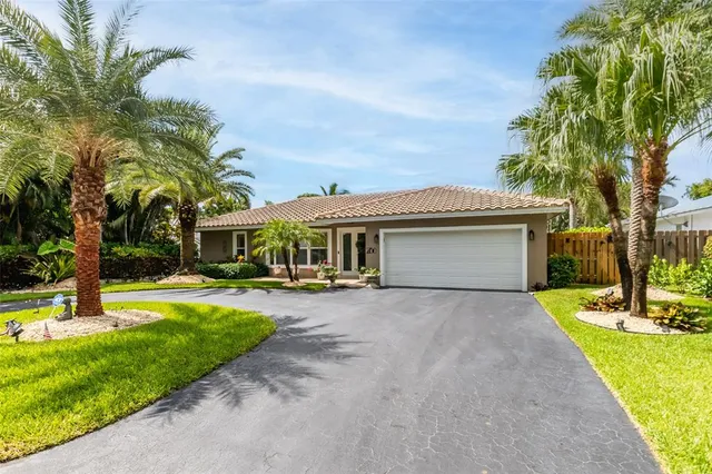 a view of a house with swimming pool and sitting area