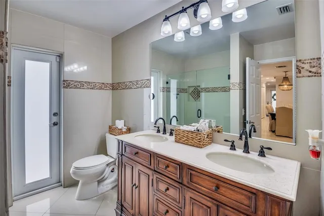 a living room filled with furniture and a potted plant