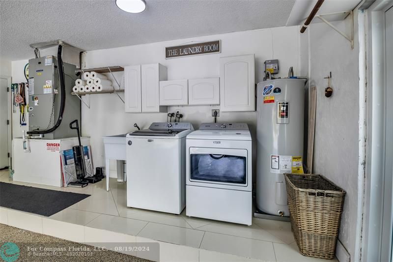 Undisclosed Address Pompano Beach, FL 33062 - Photo 44 of 63 a utility room with refrigerator and washer