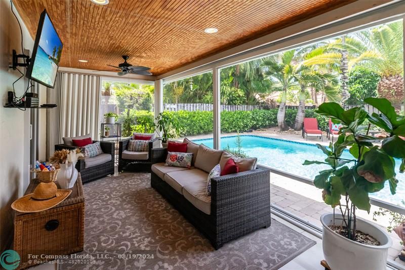 Undisclosed Address Pompano Beach, FL 33062 - Photo 49 of 63 a living room with patio furniture and a potted plants