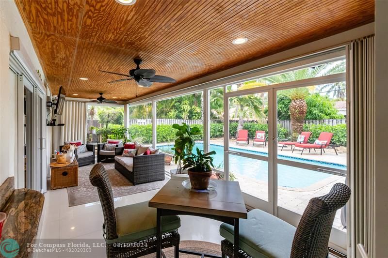 Undisclosed Address Pompano Beach, FL 33062 - Photo 50 of 63 a dining room with furniture a rug and a large window