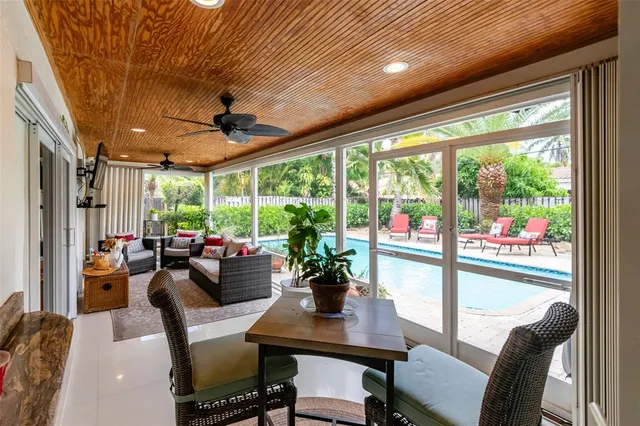a front view of a house with outdoor garden and swimming pool