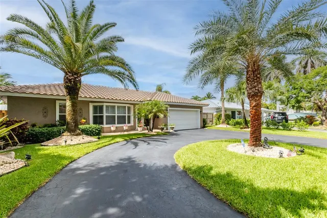 a living room with furniture a rug and a window