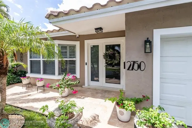 a living room with furniture a rug and a window