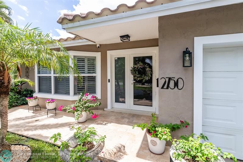 Undisclosed Address Pompano Beach, FL 33062 - Photo 6 of 63 a front view of a house