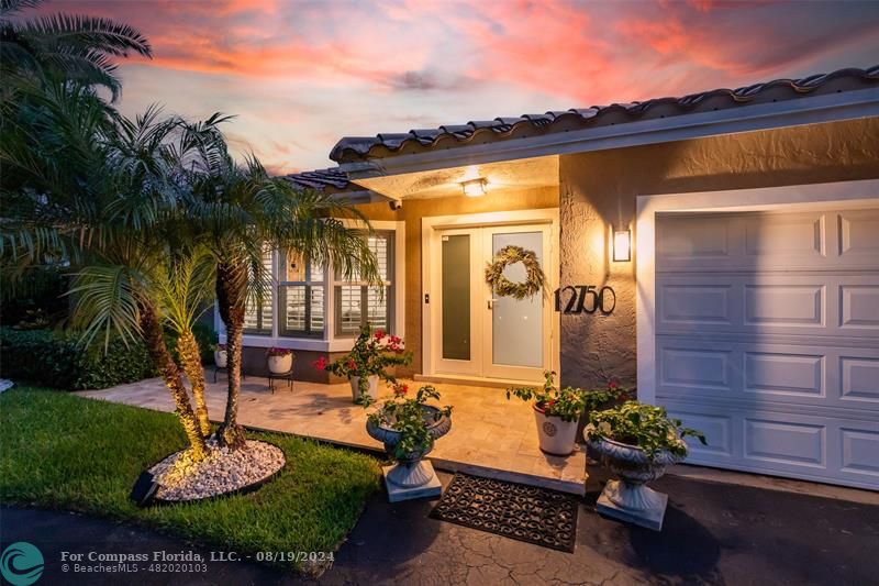 Undisclosed Address Pompano Beach, FL 33062 - Photo 61 of 63 a backyard of a house with table and chairs