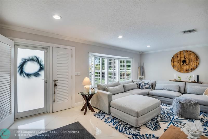 Undisclosed Address Pompano Beach, FL 33062 - Photo 7 of 63 a living room with furniture a rug and a window