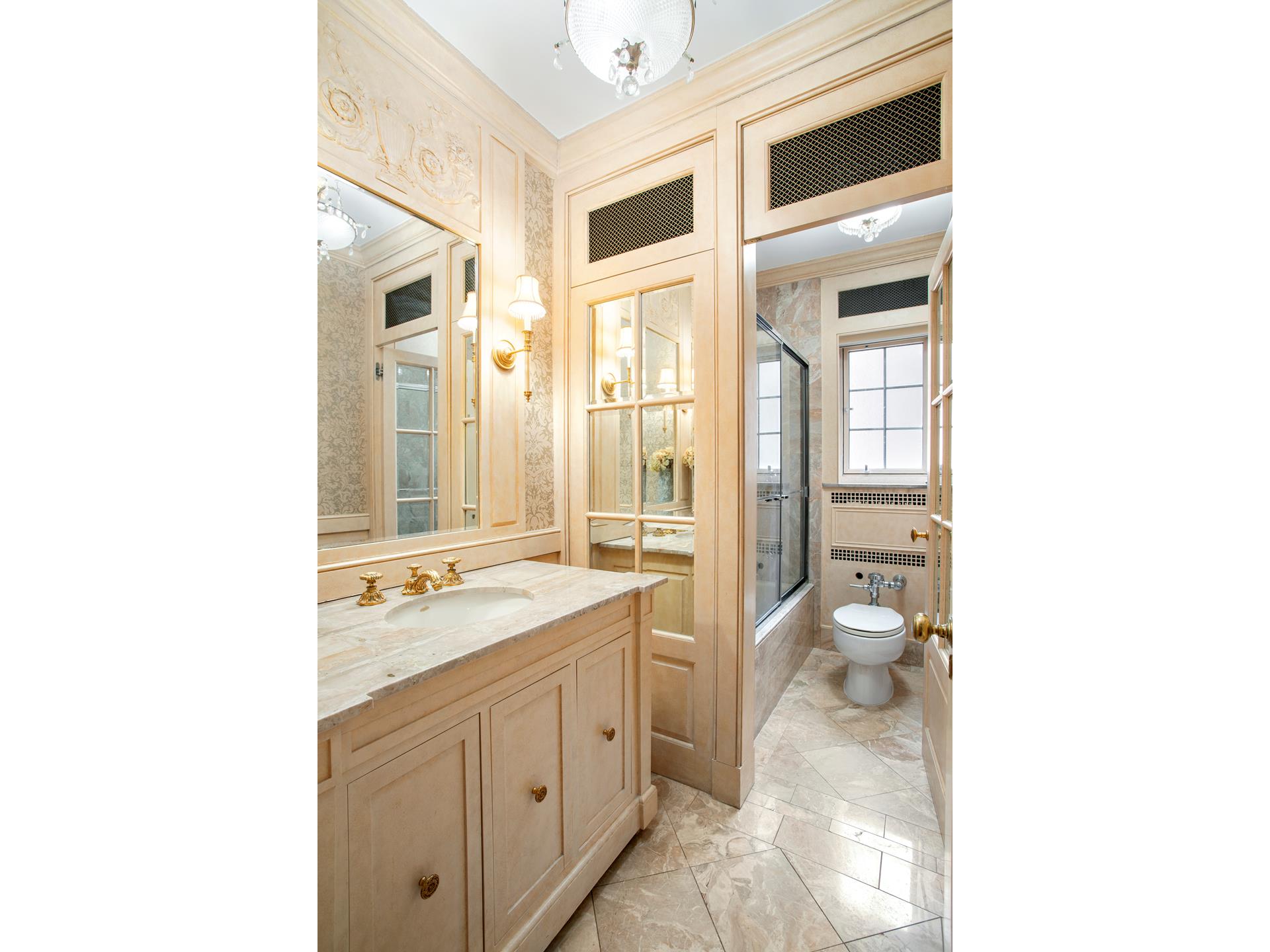 120 East End Avenue, Unit 3C Manhattan, NY 10028 - Photo 12 of 16 a spacious bathroom with a granite countertop sink a toilet and a shower