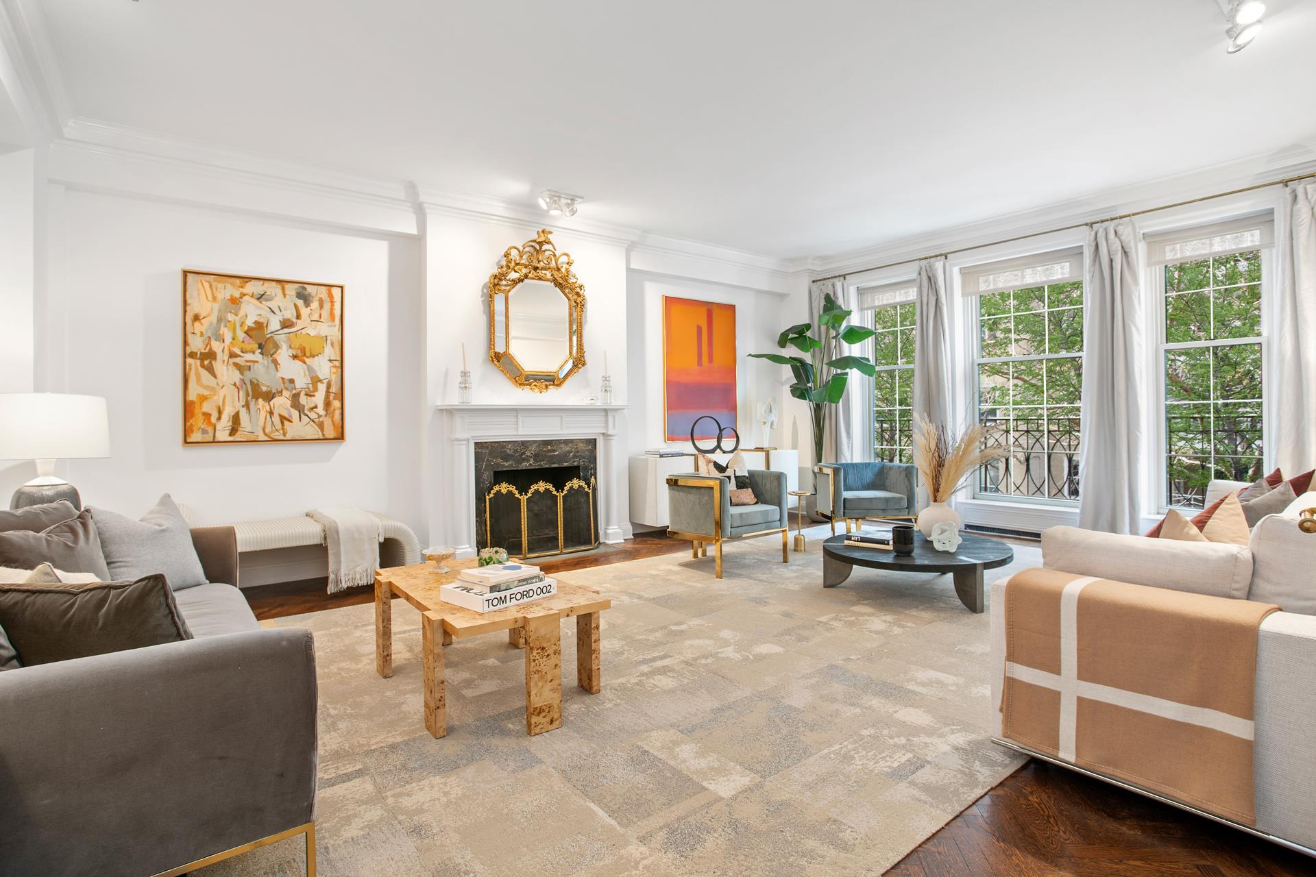 120 East End Avenue, Unit 3C Manhattan, NY 10028 - Photo 1 of 16 a living room with furniture a fireplace and a large window