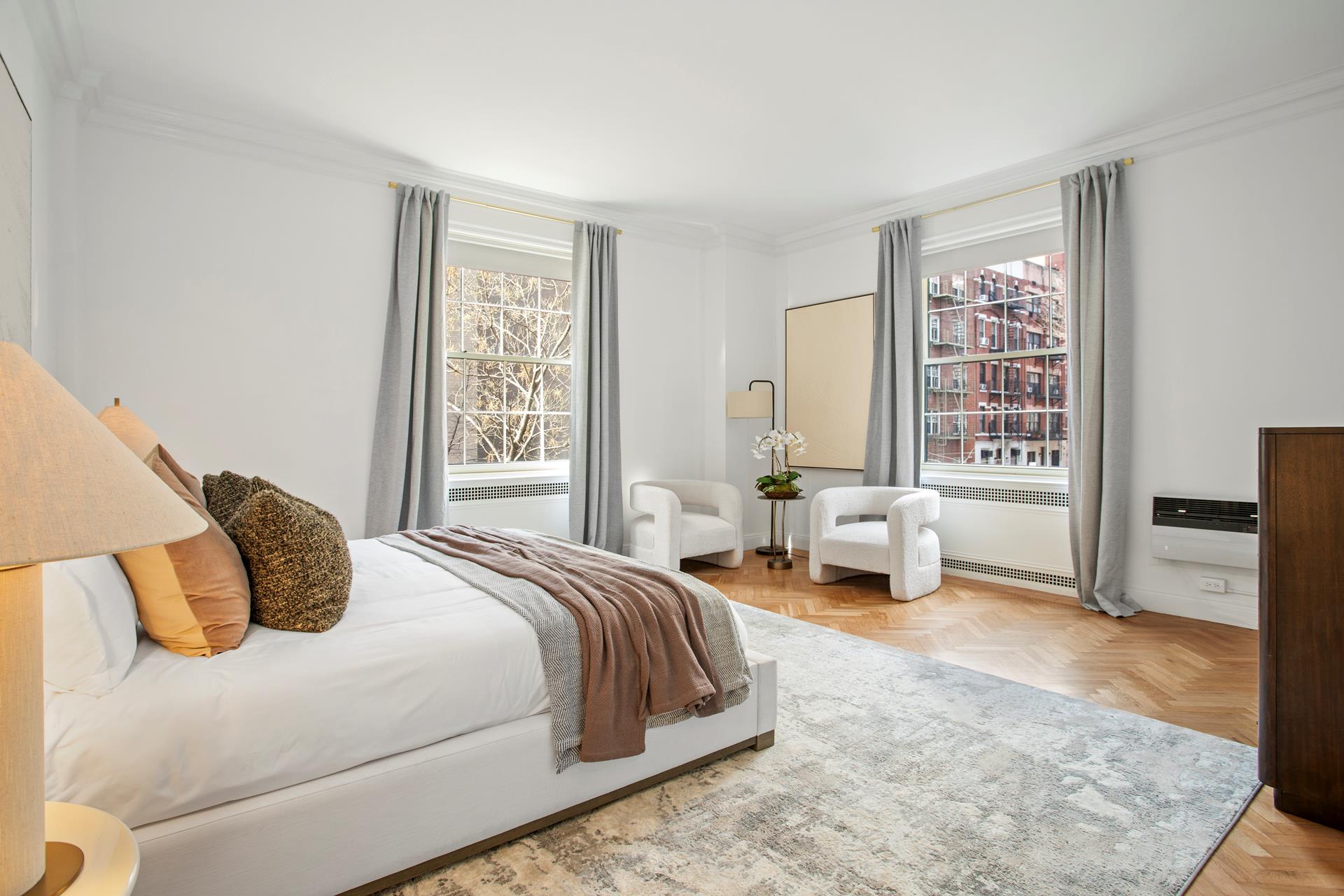 120 East End Avenue, Unit 3C Manhattan, NY 10028 - Photo 8 of 16 a bedroom with a bed and a window