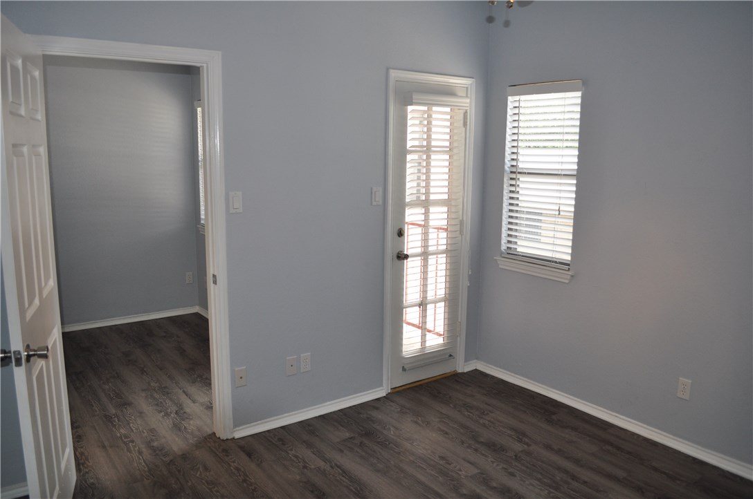 706 West 22nd Street, Unit 305 Austin, TX 78705 - Photo 12 of 20 Master bedroom with door leading to balcony