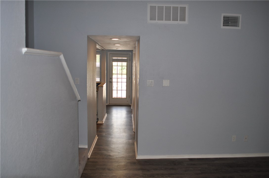 706 West 22nd Street, Unit 305 Austin, TX 78705 - Photo 5 of 20 Den looking down hallway to kitchen & balcony