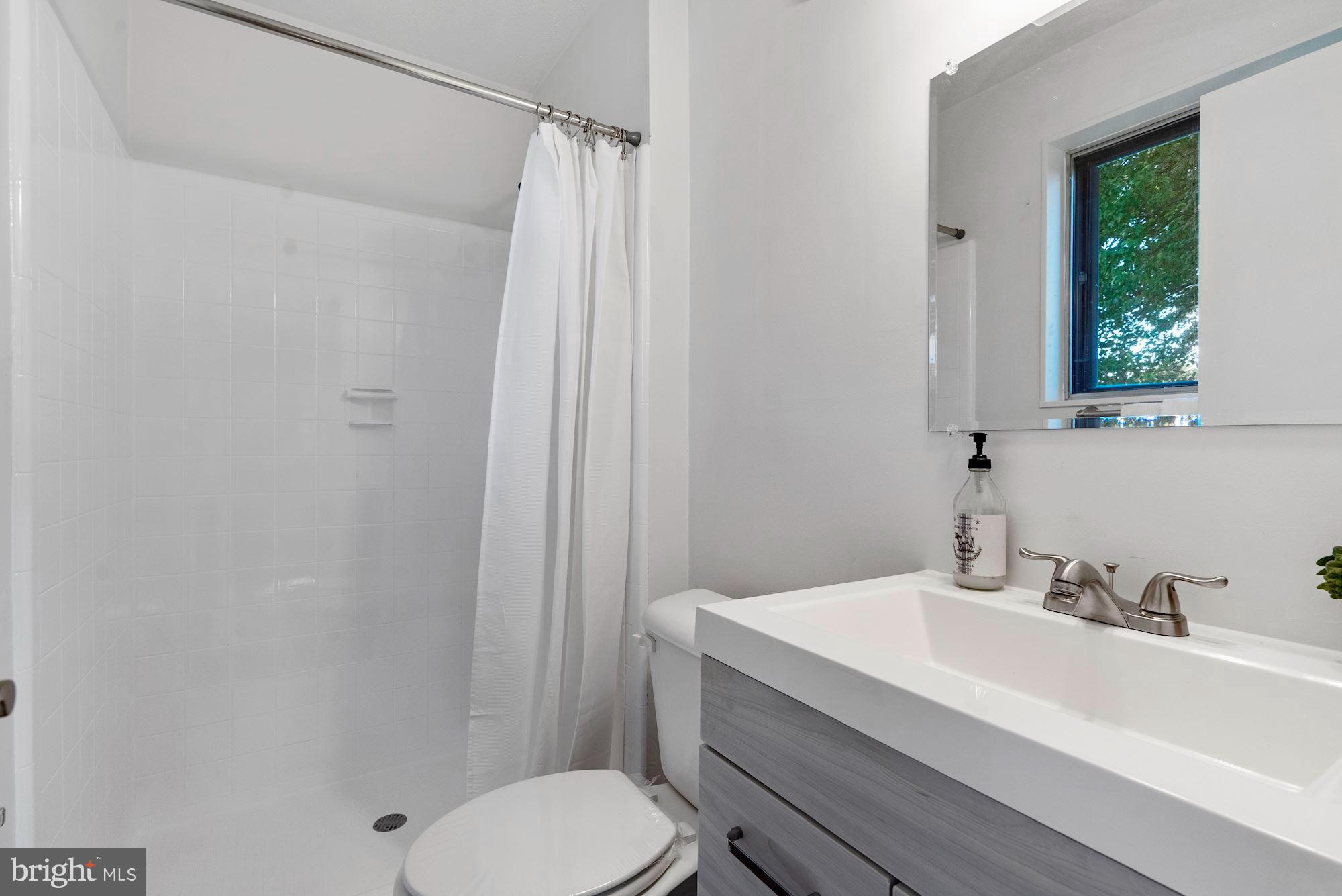 11225 Bybee Court Silver Spring, MD 20902 - Photo 21 of 31 Newly Renovated Bathroom with Tiled Showe