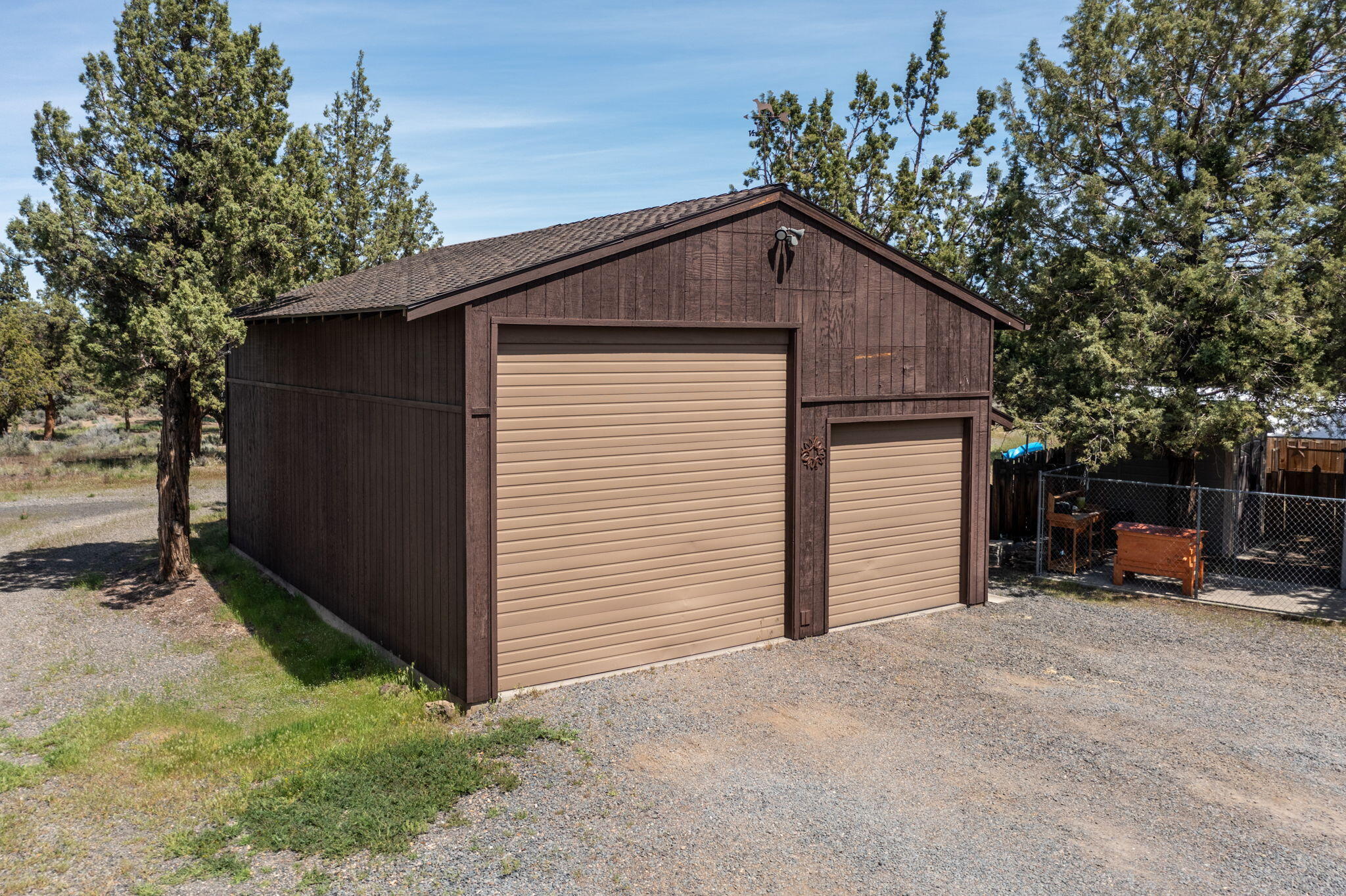 64620 McGrath Road Bend, OR 97701 - Photo 24 of 28 a view of a house with a yard and garage
