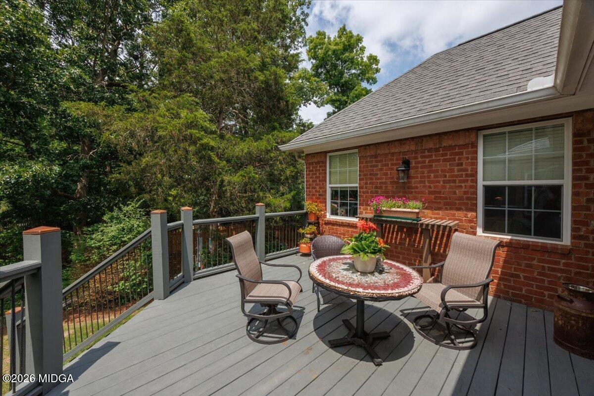 210 Oberon Place Macon, GA 31210 - Photo 27 of 31 a view of a table and chairs on the roof deck