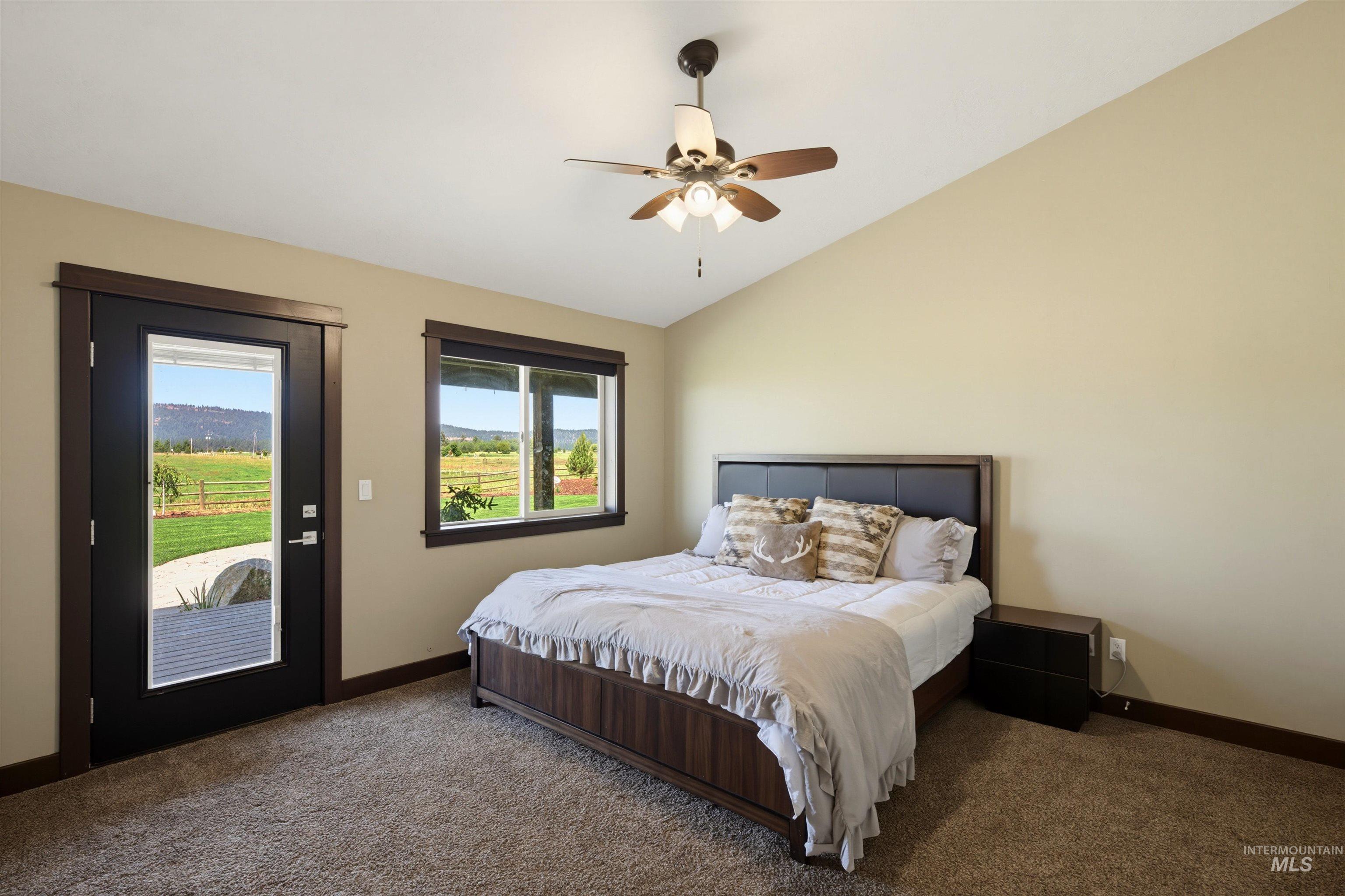 13945 Galloping Road McCall, ID 83638 - Photo 20 of 50 Room featuring vaulted ceilings and a ceiling fan with integrated lighting